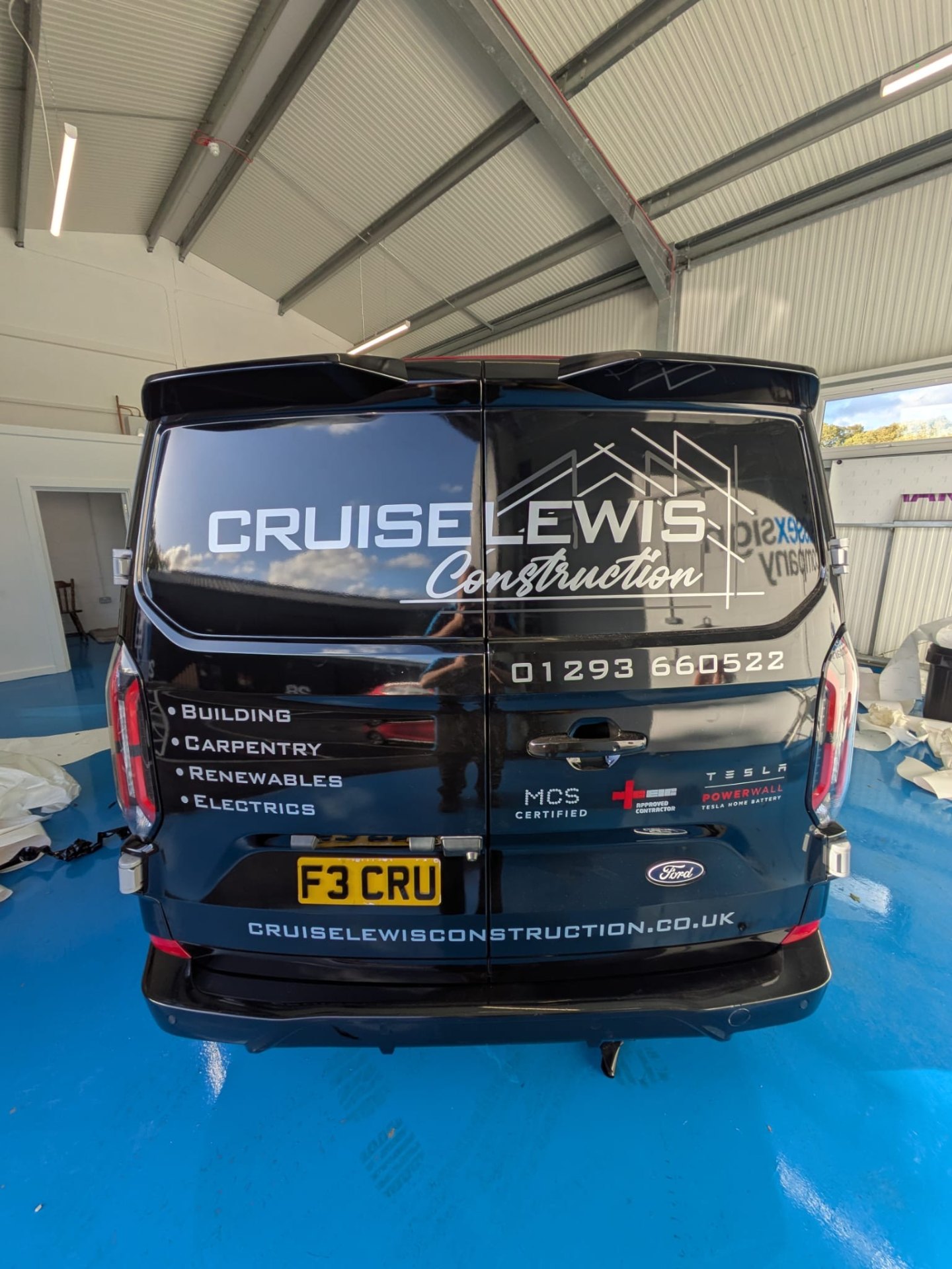 Cruise Lewis Construction van - rear view